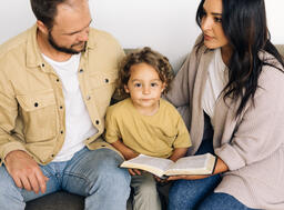 Young Family Reading the Bible Together  image 2