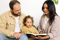 Young Family Reading the Bible Together  image 6