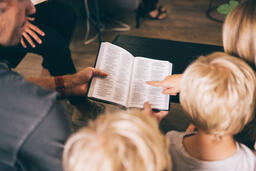 Young Family doing Devotions Together  image 1