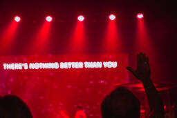 Person Raising Hand During Worship Service  image 2