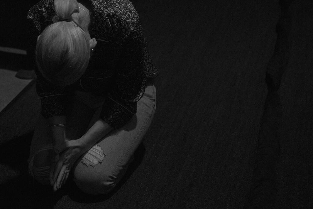 Woman Bowing in Prayer large preview