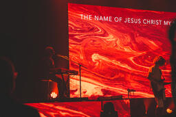 Worship Team Member Playing Keyboard on Stage  image 1