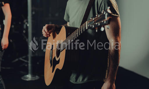 Worship Team Member with an Acoustic Guitar