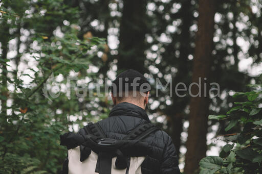 Man Hiking through the Forest