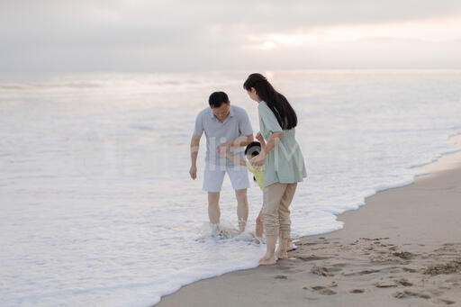 Family Playing Together at the Beach