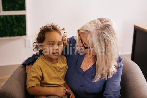 Child Sitting with Grandmother