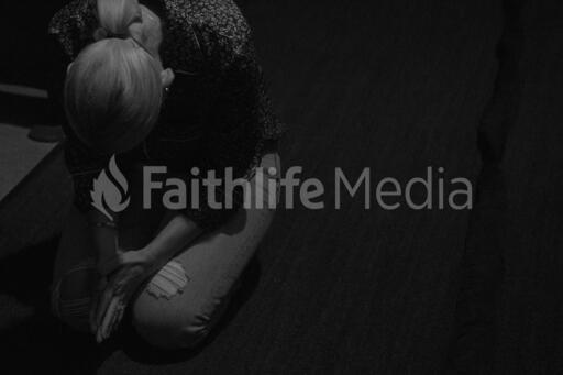 Woman Bowing in Prayer