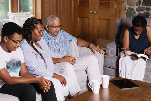 Multi-Generational Family Doing Devotions Together