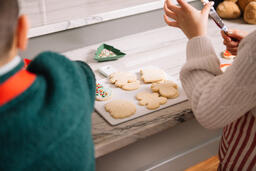 Kids Decorating Christmas Cookies Together  image 1