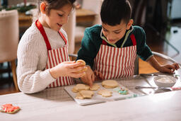 Kids Decorating Christmas Cookies Together  image 2