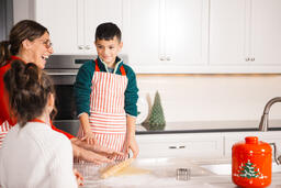 Mother and Children Baking Christmas Cookies Together  image 5