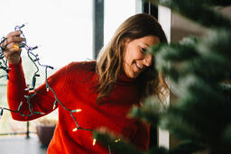 Woman Decorating a Christmas Tree  image 2