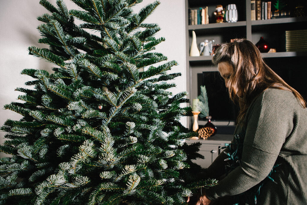 Woman Decorating a Christmas Tree large preview