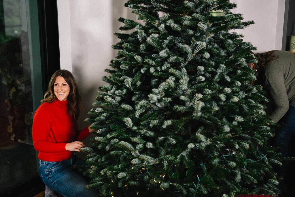 Woman Decorating a Christmas Tree large preview