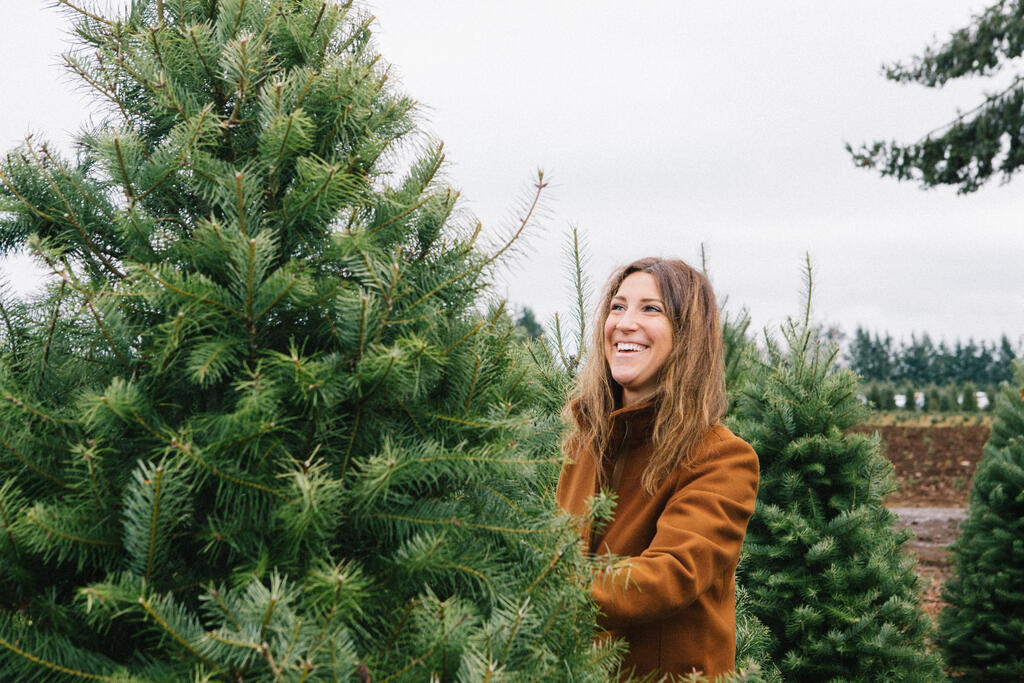 Woman Picking out a Christmas Tree Graphics for the Church