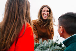 Mother Laughing with Her Children at a Christmas Tree Farm  image 2