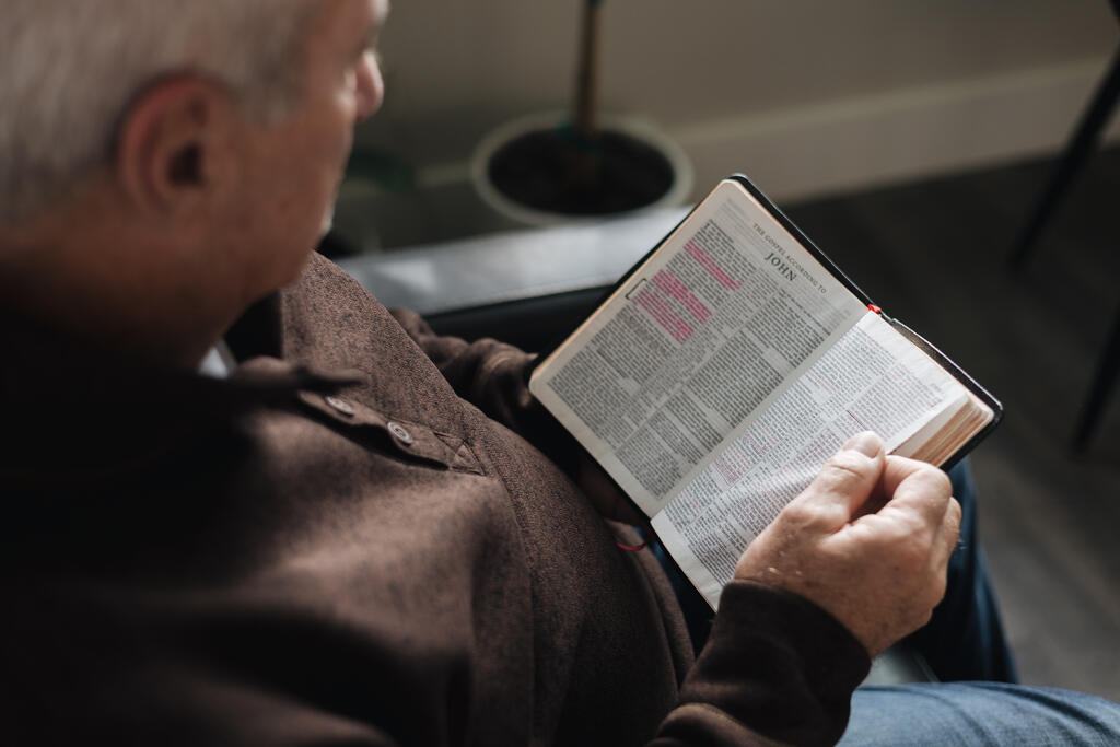 Senior Man Reading the Bible at Home large preview