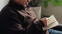 Senior Man Reading the Bible at Home  image 3