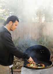 Man Serving Up Freshly-Grilled Meat and Vegetables  image 11