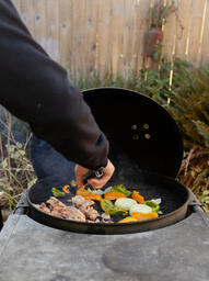Man Serving Up Freshly-Grilled Meat and Vegetables  image 21