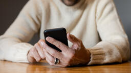 Man Scrolling on His Phone Alone  image 2