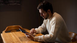 Man Reading on an iPad Alone  image 8