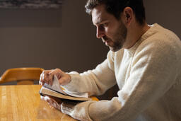 Man Reading the Bible Alone  image 1