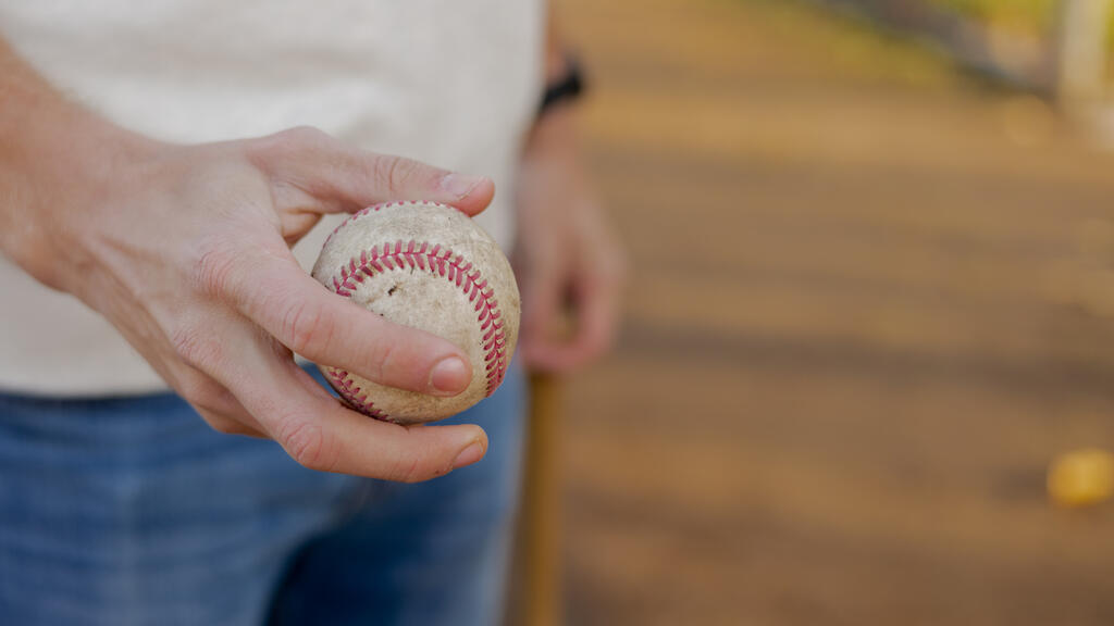 Man Holding a Baseball large preview