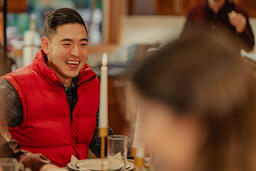 Friends Laughing and Enjoying a Meal Together  image 2