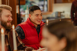 Friends Laughing and Enjoying a Meal Together  image 1