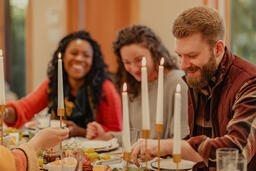 Friends Laughing and Enjoying a Meal Together  image 1