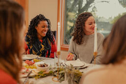 Friends Laughing and Enjoying a Meal Together  image 3