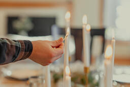 Man Lighting Candles at the Thanksgiving Table  image 2