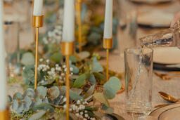 Man Pouring Water into Glasses at Thanksgiving Table  image 6