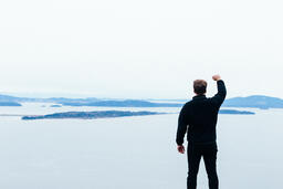 Man Raising His Hands in Worship Outside  image 2