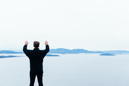 Man Raising His Hands in Worship Outside  image 1