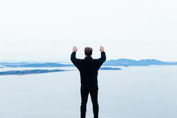 Man Raising His Hands in Worship Outside  image 2