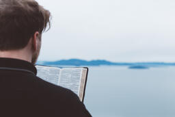Man Reading the Bible Outside  image 1