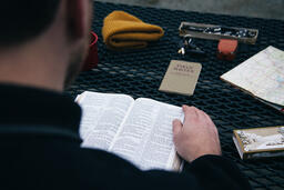 Man Reading the Bible while Camping  image 3
