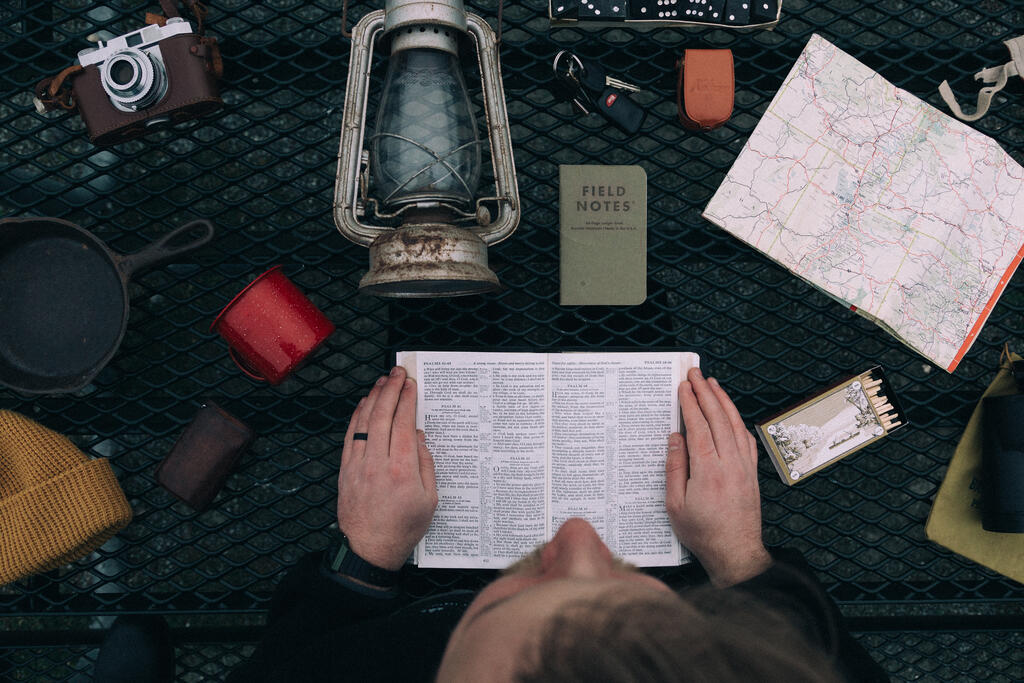 Man Reading the Bible while Camping large preview