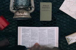 Man Reading the Bible while Camping  image 2