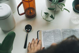 Woman Reading the Bible while Making Coffee  image 8