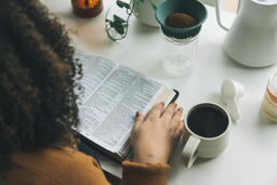 Woman Reading the Bible while Making Coffee  image 3