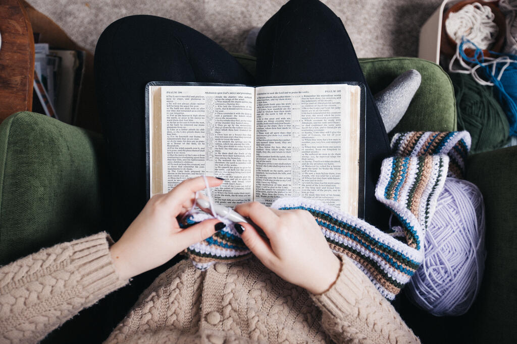 Woman Reading the Bible While Crocheting large preview