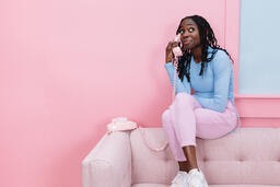Woman Talking on a Pink Telephone  image 2