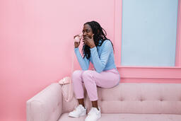 Woman Talking on a Pink Telephone  image 1