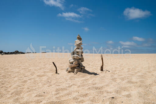 Rocks Stacked and Balanced on the Beach
