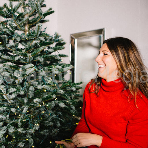 Woman Decorating the Christmas Tree