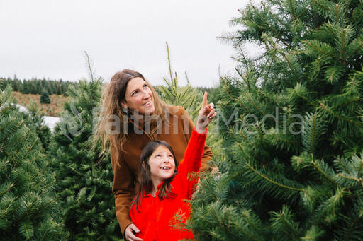 Mother and Daughter at a Christmas Tree Farm