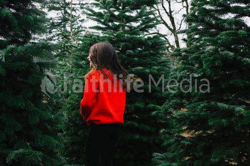 Young Girl at a Christmas Tree Farm